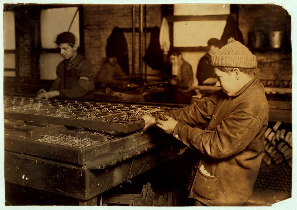 Boys 'linking' bed-springs. 14 and 15 years old. LOC cph.3a03109
