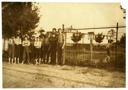Boys at the gate, and one running off, work in Schoolfield Mills, Danville, Va. LOC nclc.02161