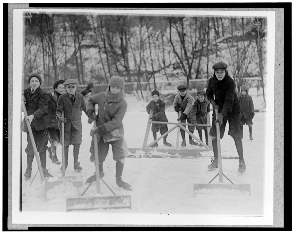 Boys cleaning snow off the ice, so that they can ice skate, Washington, D.C., area LCCN96509169