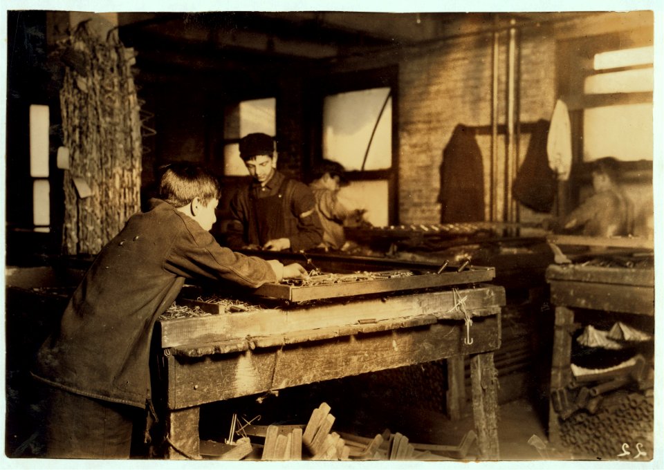 Boys 'linking' bed-springs. 14 and 15 years old. LOC nclc.05126