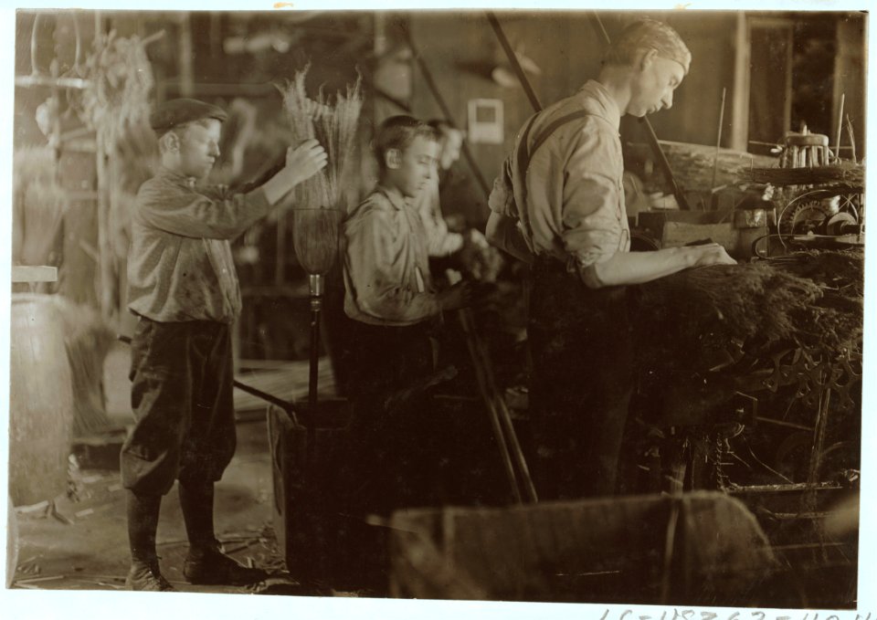 Boys assisting at the Broom Machines. S. W. Brown Mfg. Co.,. LOC nclc.04476