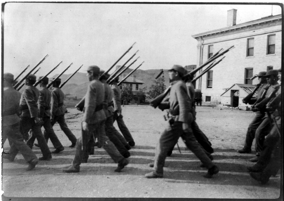 Boys at drill (marching), Golden Industrial School, Denver, Colorado- Side view of boys marching in foreground LCCN2003654721