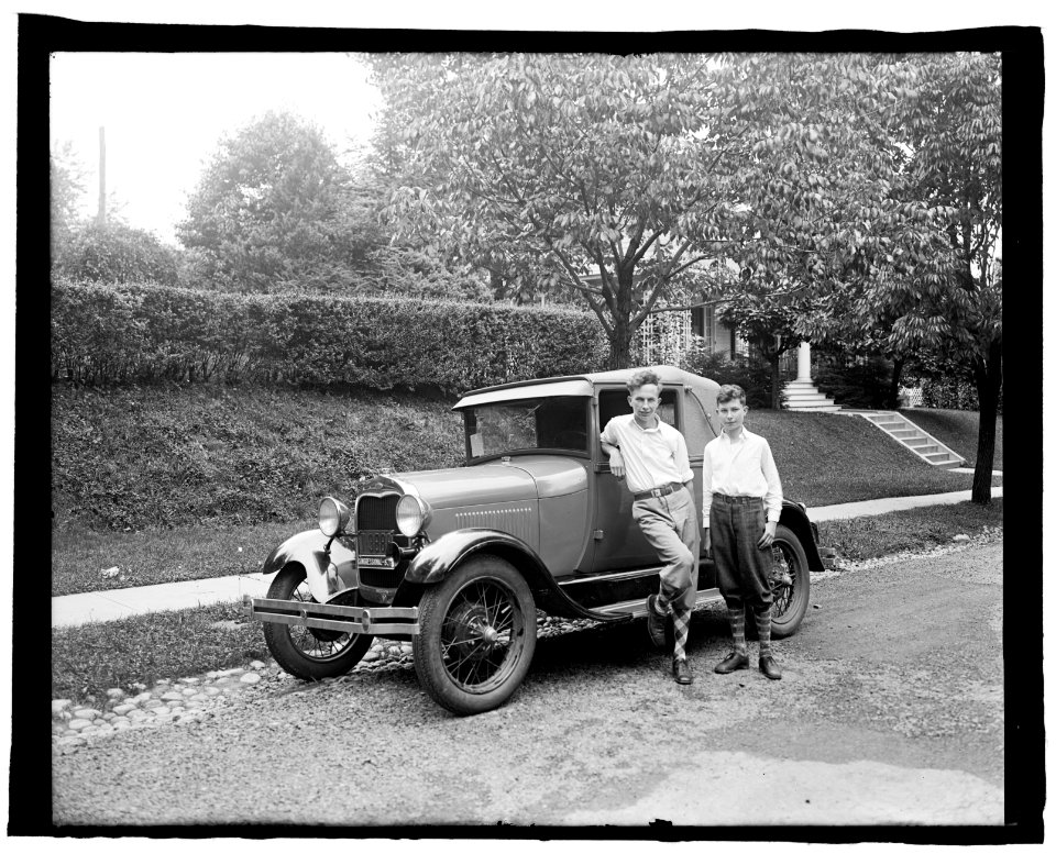 Boys standing next to automobile LCCN2016824558
