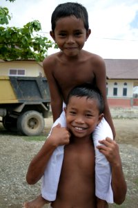 Boys playing around near a community development project in Teumareum funded by USAID. (5073750481)
