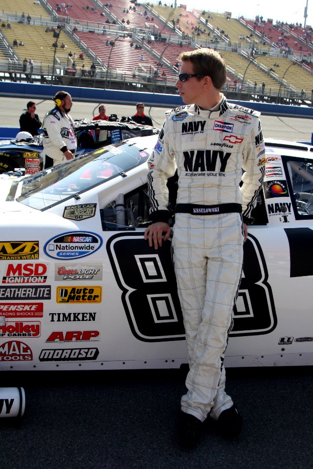 Brad Keselowski in front of car at Fontana