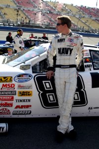 Brad Keselowski in front of car at Fontana