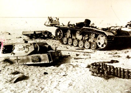 Bren Gun Carrier passing destroyed vehicles after enemy had retreated, WWII (37245013425)
