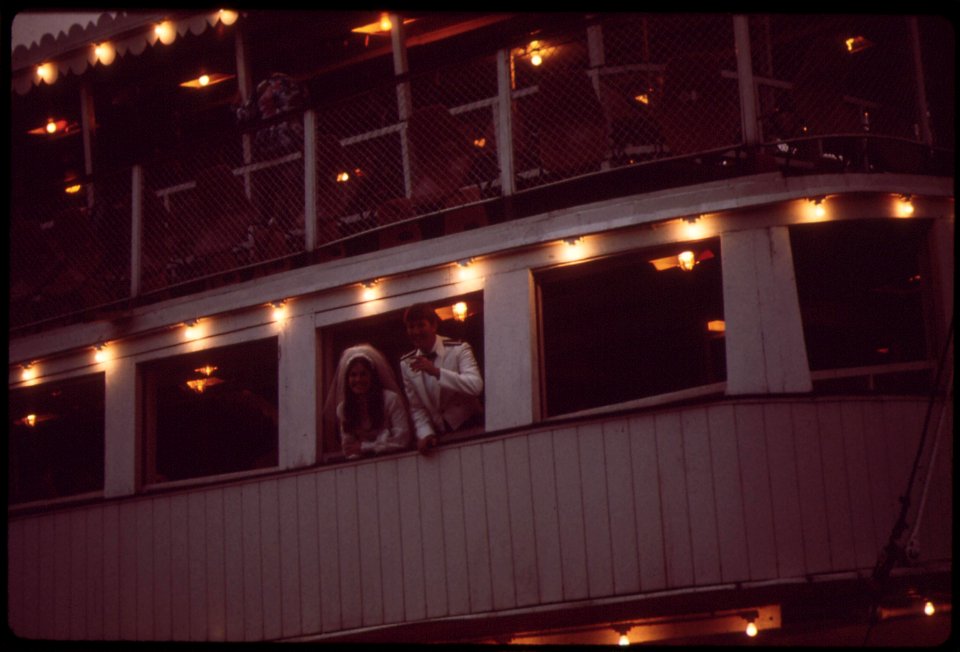 Bride-and-groom-at-wedding-reception-on-the-belle-of-louisiana-steamboat-may-1972 7651266384 o
