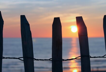 Sunset fence dune photo
