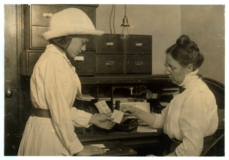 Child Labor Scholarship. Girl securing her weekly allowance from the New York Child Labor Committee, that permits her parents in school. June 1913. LOC nclc.05515