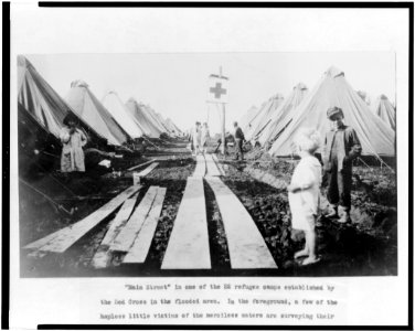 Children along Main Street in refugee camp set up by the Red Cross for flood victims LCCN96500025