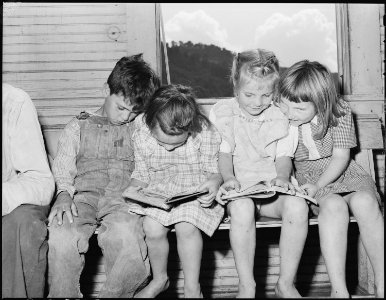 Children in primary grades looking at books. Kentucky Straight Creek Coal Company, Belva Mine, abandoned after... - NARA - 541238