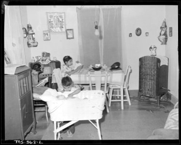 Children of Alfonso Cabral, miner, in living room of their home in company housing project. Calumet Fuel Company... - NARA - 540374