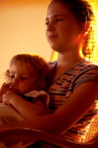 Children in a rocking chair photo