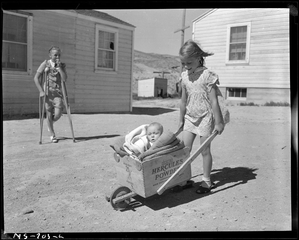 Children of miner living in company housing project. Note the homemade baby buggy made of a powder box. Union Pacific... - NARA - 540560