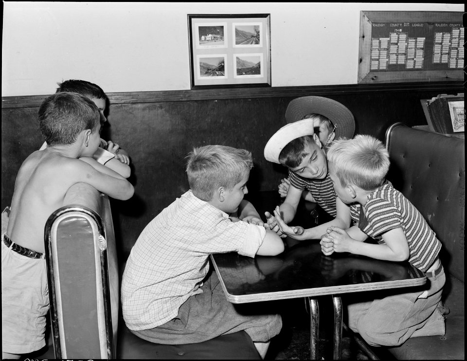 Children of miners in booth of company owned grill. The grill is one of the social centers of this community. Koppers... - NARA - 540926