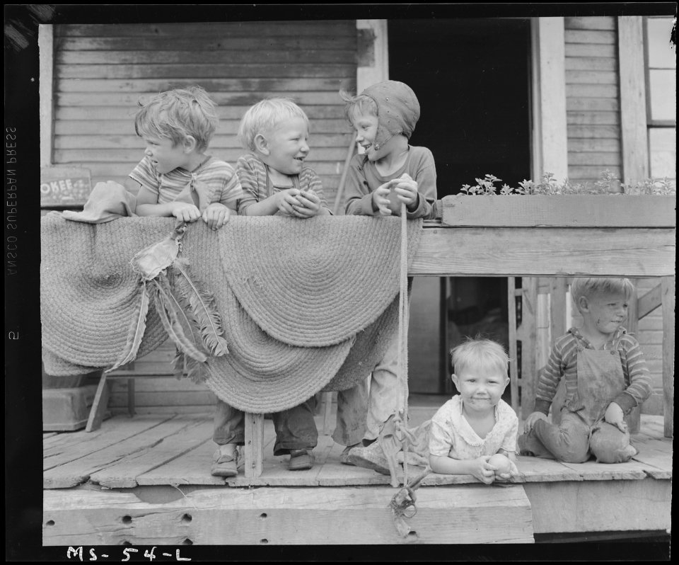 Children of miners on front porch of house in company project. Louise Coal Company, Louise Mine, Osage, Monongalia... - NARA - 540246