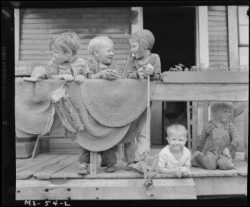 Children of miners on front porch of house in company project. Louise Coal Company, Louise Mine, Osage, Monongalia... - NARA - 540246
