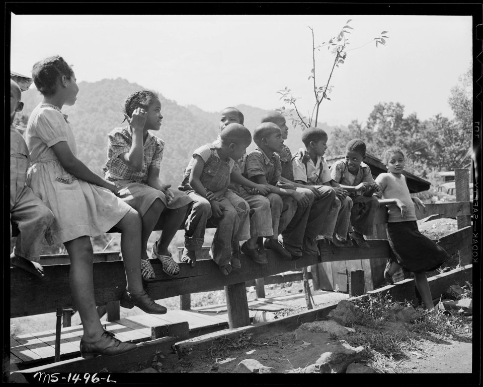 Children of miners on the fence in front of the Howard house. Gilliam Coal and Coke Company, Gilliam Mine, Gilliam... - NARA - 540819