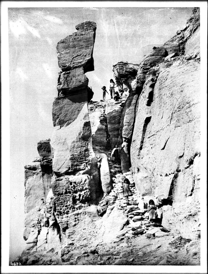 Children on the steps of the southeast trail to the Hopi pueblo of Walpi, on the First Mesa, Arizona, ca.1898 (CHS-4634)