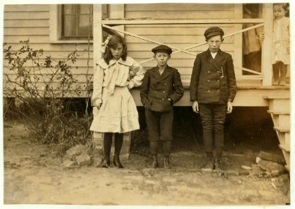 Children of night superintendent, in Dickson Mill, Laurinburg, N.C. (1) Bessie Moore - runs 4 sides. Has worked two years nights. (2) Frank (smallest). Doffs. Has worked 2 yrs. nights. (3) LOC nclc.01505