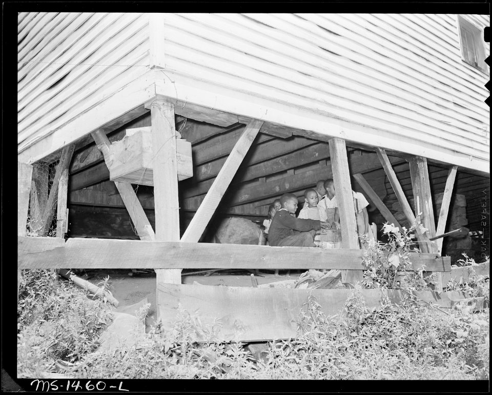 Children play beneath the house where the James Robert Howard family lives. Gilliam Coal and Coke Company, Gilliam... - NARA - 540801