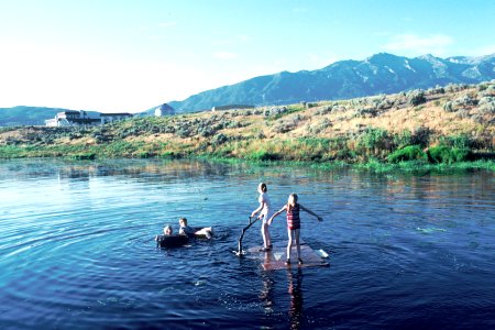 Children playing in a lake photo