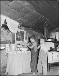 Children washing their hands in the house of Mrs. Leanore Miller, widow of a miner. Kentucky Straight Creek Coal... - NARA - 541243