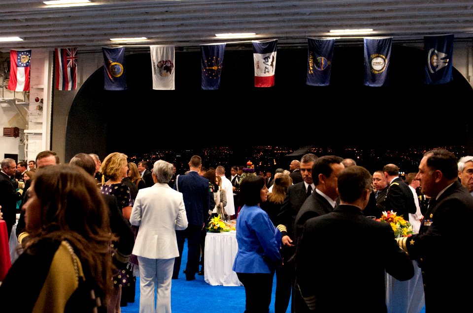 Chilean dignitaries, military officials and distinguished guests join U.S. Sailors and Marines for a reception aboard the amphibious assault ship USS America (LHA 6) Aug. 25, 2014, in Valparaiso, Chile 140825-N-LQ799-247