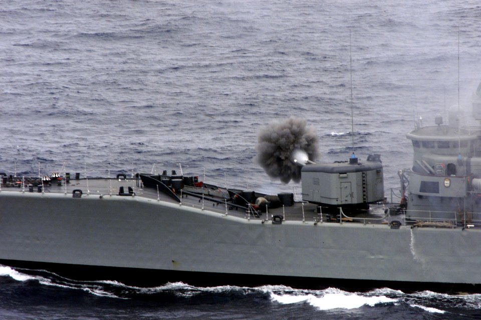 Chilean frigate Almirante Condell fires guns in 1999