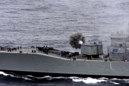Chilean frigate Almirante Condell fires guns in 1999