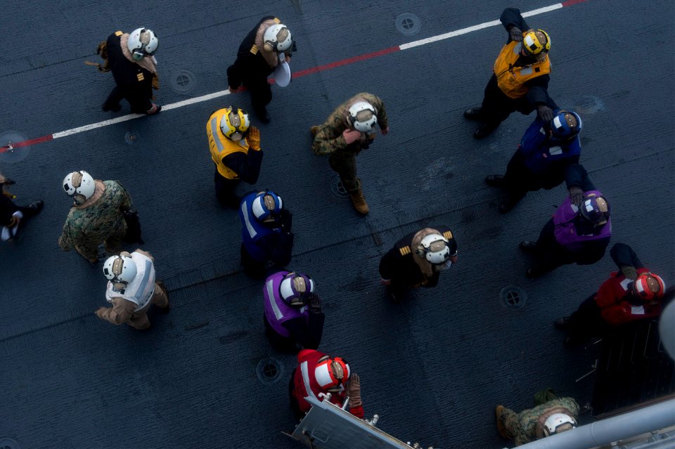 Chilean distinguished visitors land aboard USS America 140824-N-MD297-156