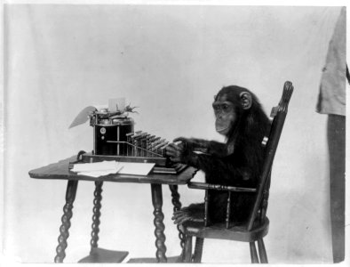 Chimpanzee seated at a typewriter