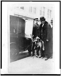 Chimpanzee in clothing at door of automobile, with three men, at Napoleon Hippodrome LCCN94514005 photo
