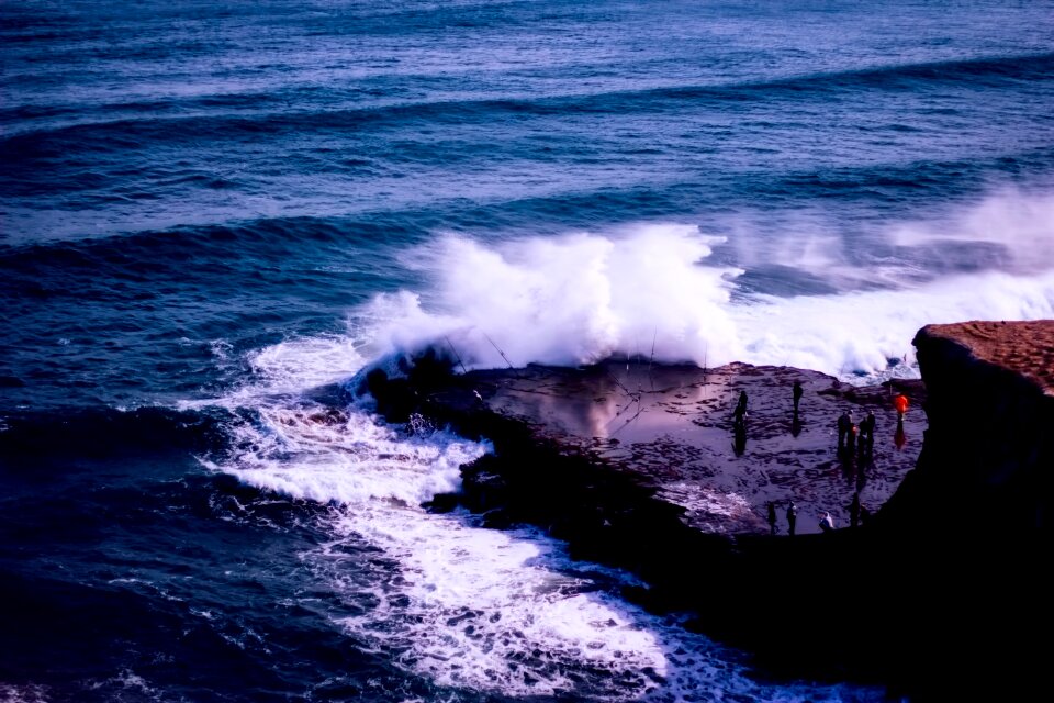 Figures crashing waves nature