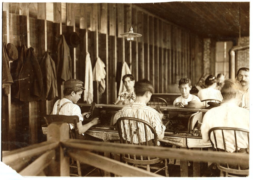 Cigarmakers in factory of Filogamo & Alvarez, Tampa, Fla. Work was slack. LOC nclc.05408