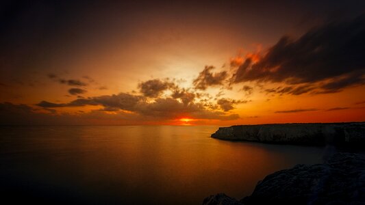 Ocean rock clouds photo