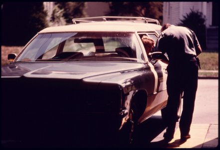 City Employee Hired by the Norwood, Ohio, Public Works Department, Greets a Motorist Ready to Enter the Safety Lane at the Auto Emission Inspection Station 08-1975. (4266523982)