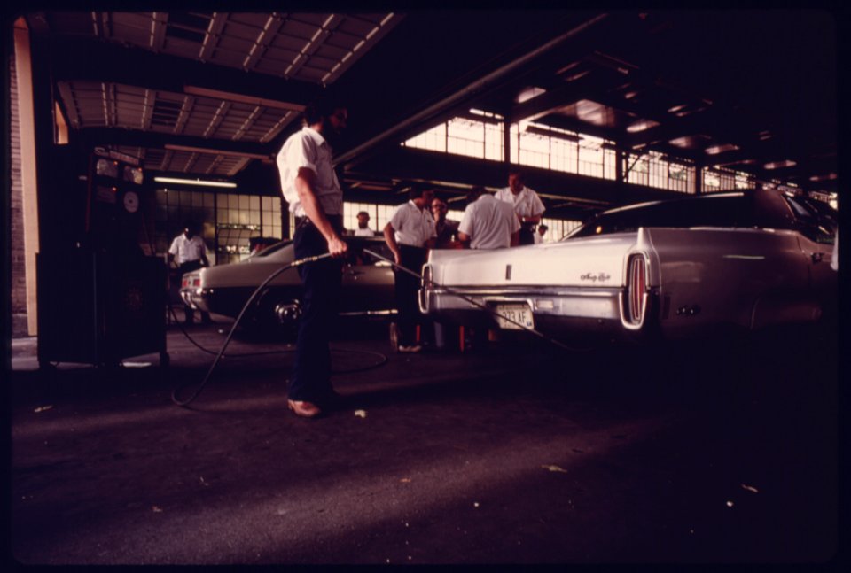 City Employee of an Auto Emission Inspection Station in Downtown Cincinnati, Ohio...08-1975 (4266536192)