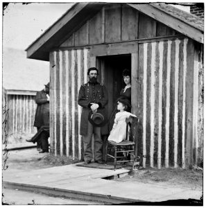City Point, Va. Brig. Gen. John A. Rawlins, Chief of Staff, with wife and child at door of their quarters LOC cwpb.02955