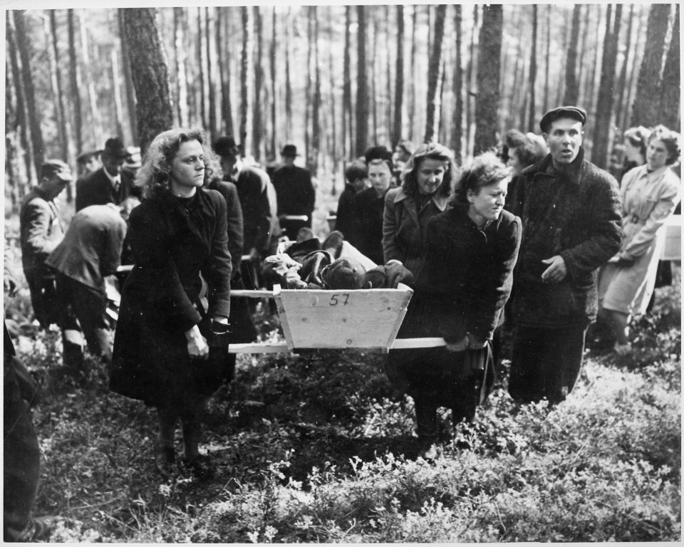 Civilians of Neunburg bear victims of SS killings to burial ground, after bodies were exhumed from mass grave where... - NARA - 531346