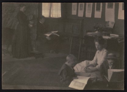 Clarence H. White and family reading in Newark parlor or dining room LCCN2017658524