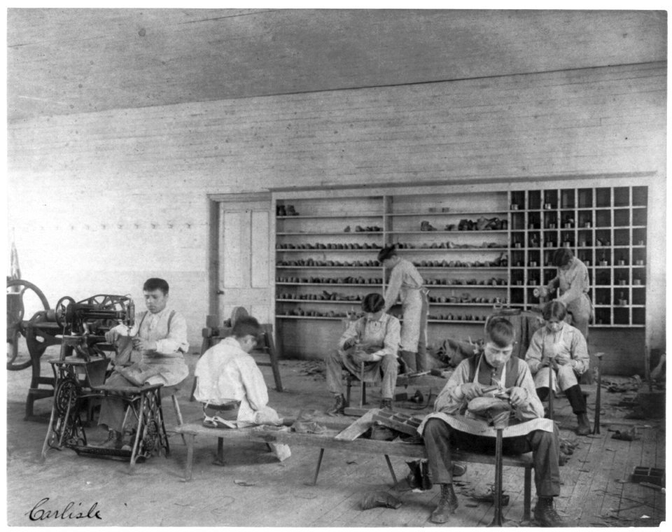 Classroom scenes at Carlisle, Pa., Indian School. Shoe making and repairing; male students LCCN2006675679