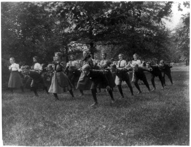 Classroom scenes in Washington, D.C. public schools - outdoor exercise with rods - 3rd Division LCCN2001703660