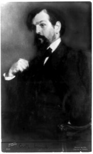 Claude Debussy, half-length portrait, seated, facing left) - portrait by J.E. Blanche ; photo by Em. Crevaux, Paris LCCN89711902