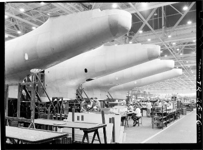 Construction of aircraft at the Glenn L. Martin plant at Baltimore, MD. Fuselages, just out of the assembly jigs are... - NARA - 520743