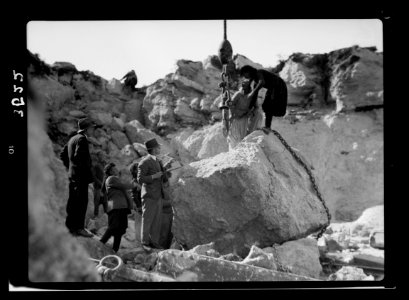 Construction of the Haifa harbour. The Athlit quarries. Crane raising huge boulder LOC matpc.15384