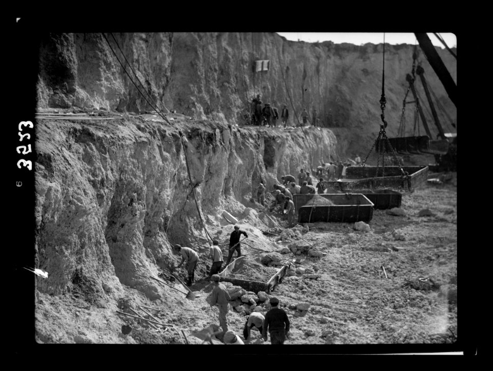 Construction of the Haifa harbour. The Athlit quarries. Loading R.R. (i.e., railroad) car skiffs LOC matpc.15385