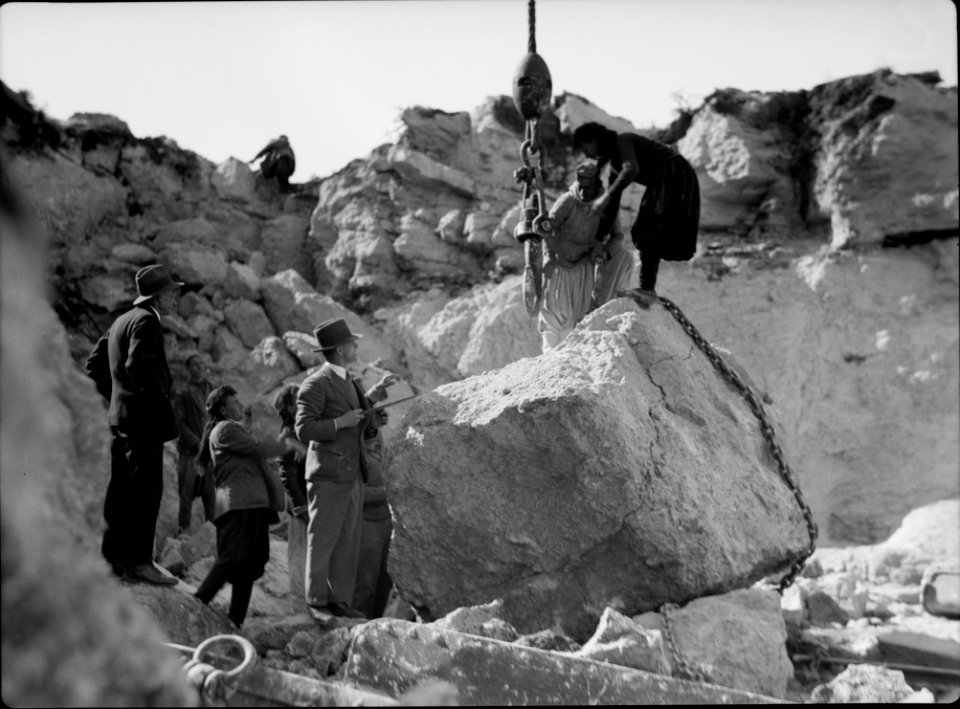 Construction of the Haifa harbour. The Athlit quarries. Crane raising huge boulder LOC matpc.15384