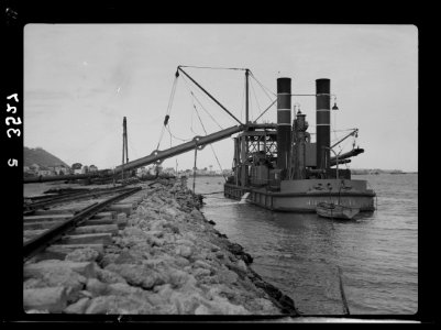 Construction of the Haifa harbour. Sand pump in Haifa harbour. Pumping sand upon reclaimed area LOC matpc.15388